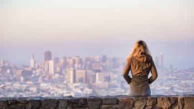 woman watching the city at dusk