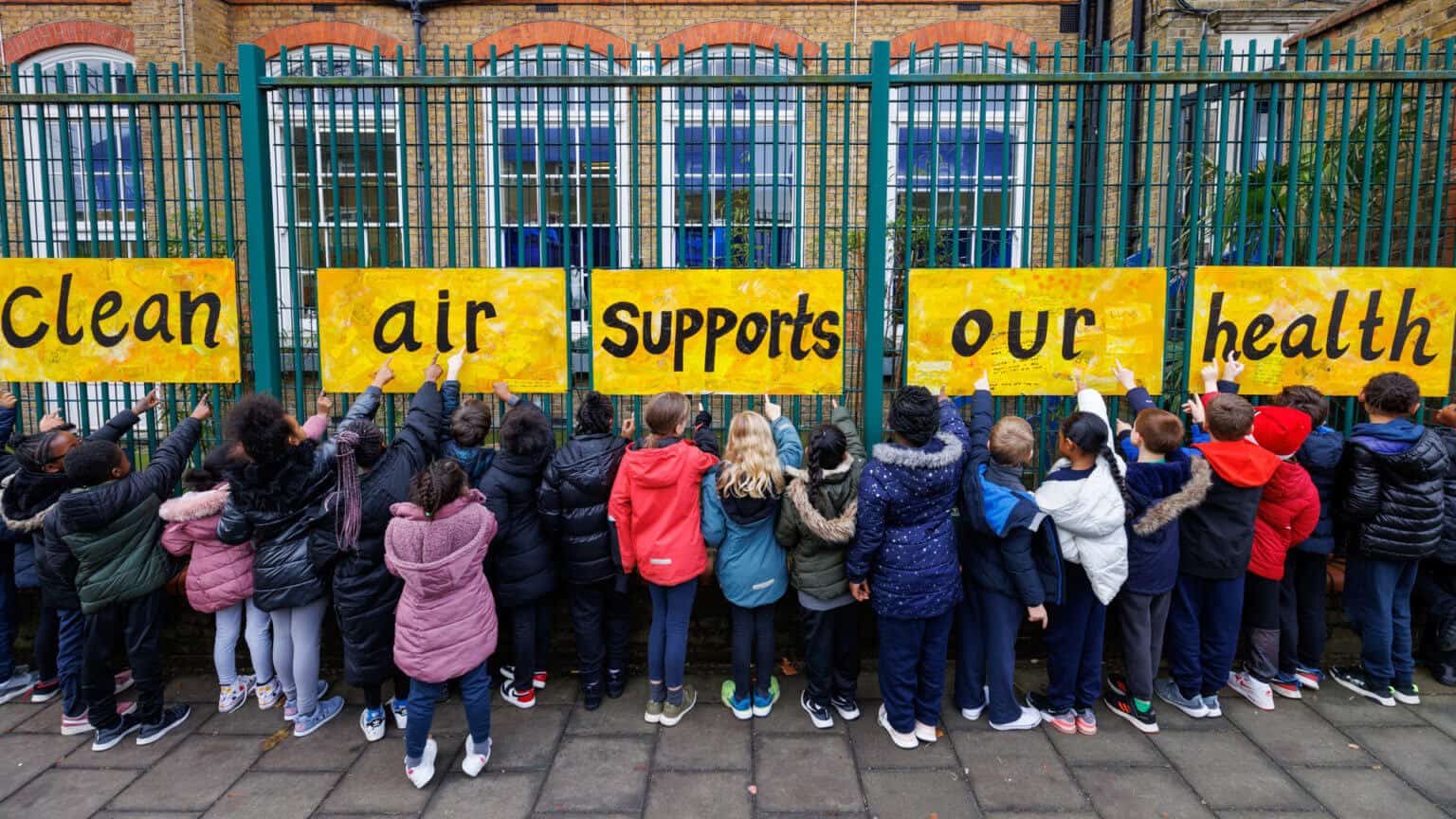 children with "clean air" signs
